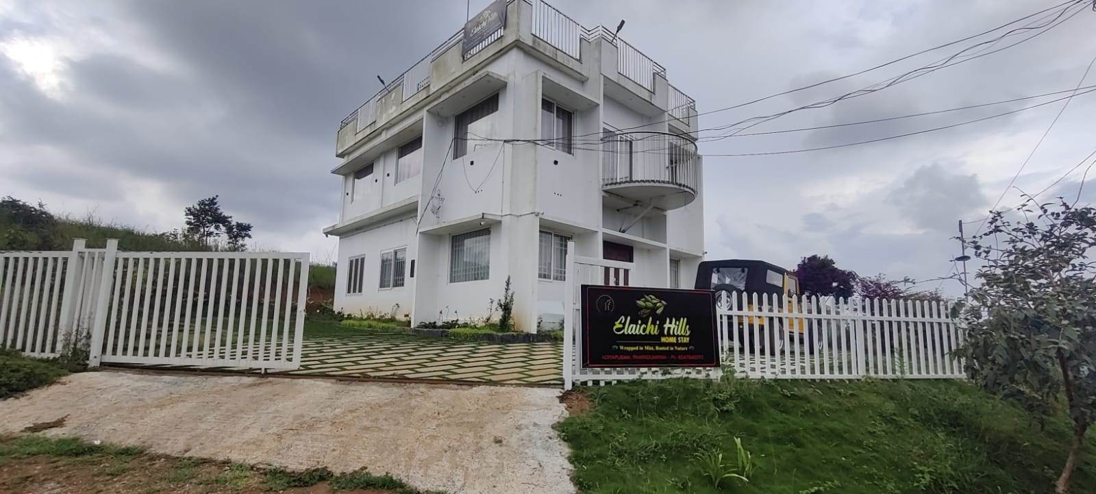 Elaichi Hills entrance and building, street view